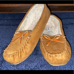 Brown moccasins with fur on the inside